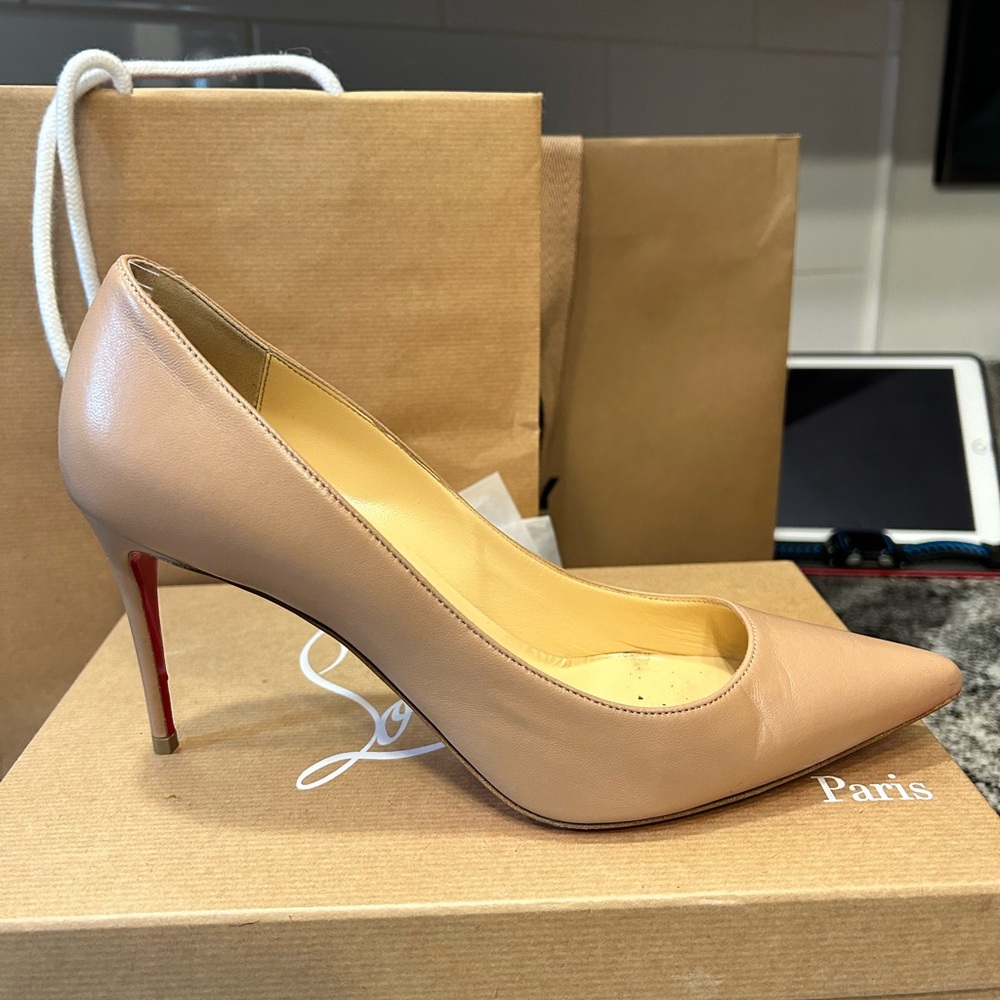 Louboutin heels. Worn one time. Box Bag Dust bag included .